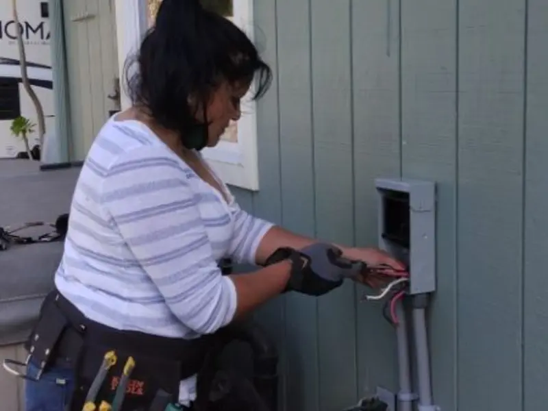 Licensed electrician wiring an exterior subpanel in Callicoon