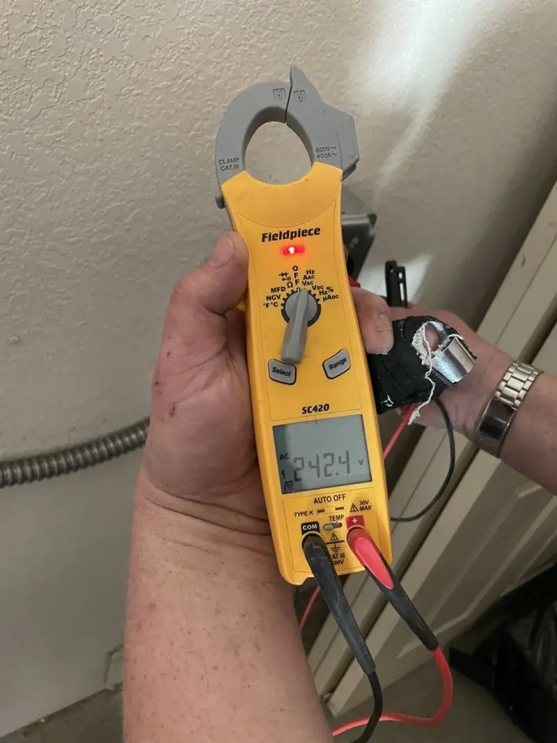 Voltage testing with clamp meter during Electrical Installation Services in Callicoon